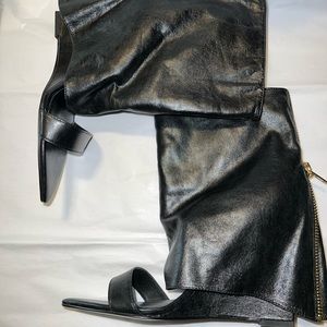 New, Black leather fold over sandal bootie. 4 inch wedge heel. Size 8.5. No box